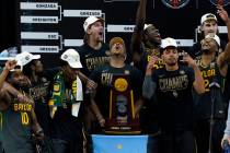 Baylor players celebrate with the trophy after the championship game against Gonzaga in the men ...