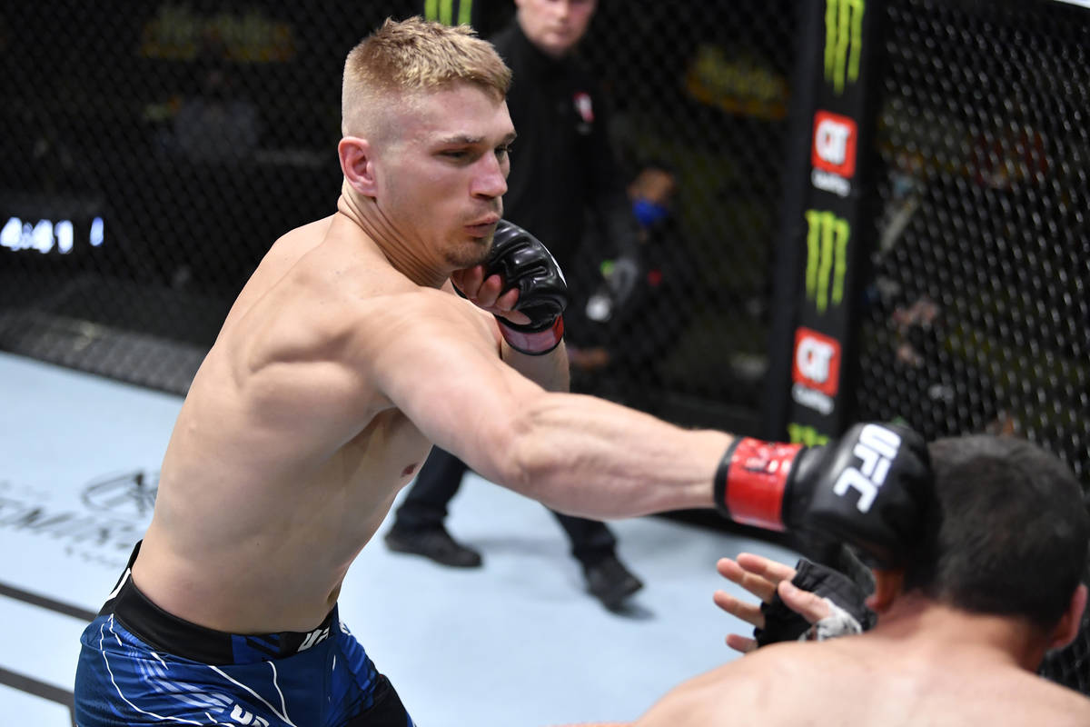 Austin Hubbard punches Dakota Bush in a lightweight fight during the UFC Fight Night event at U ...