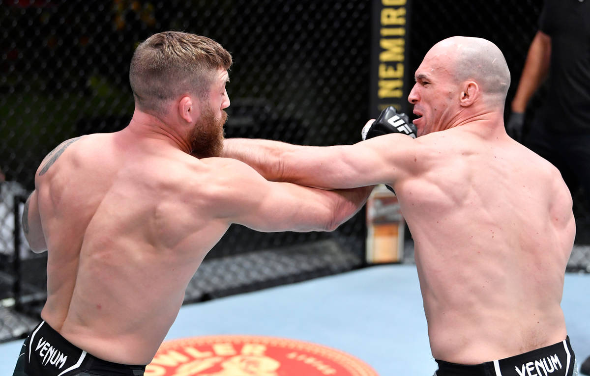 Bartosz Fabinski of Poland and Gerald Meerschaert trade punches in a middleweight fight during ...