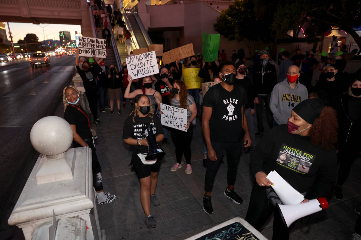 People protest on the Strip in Las Vegas Saturday, April 17, 2021, following the fatal police s ...