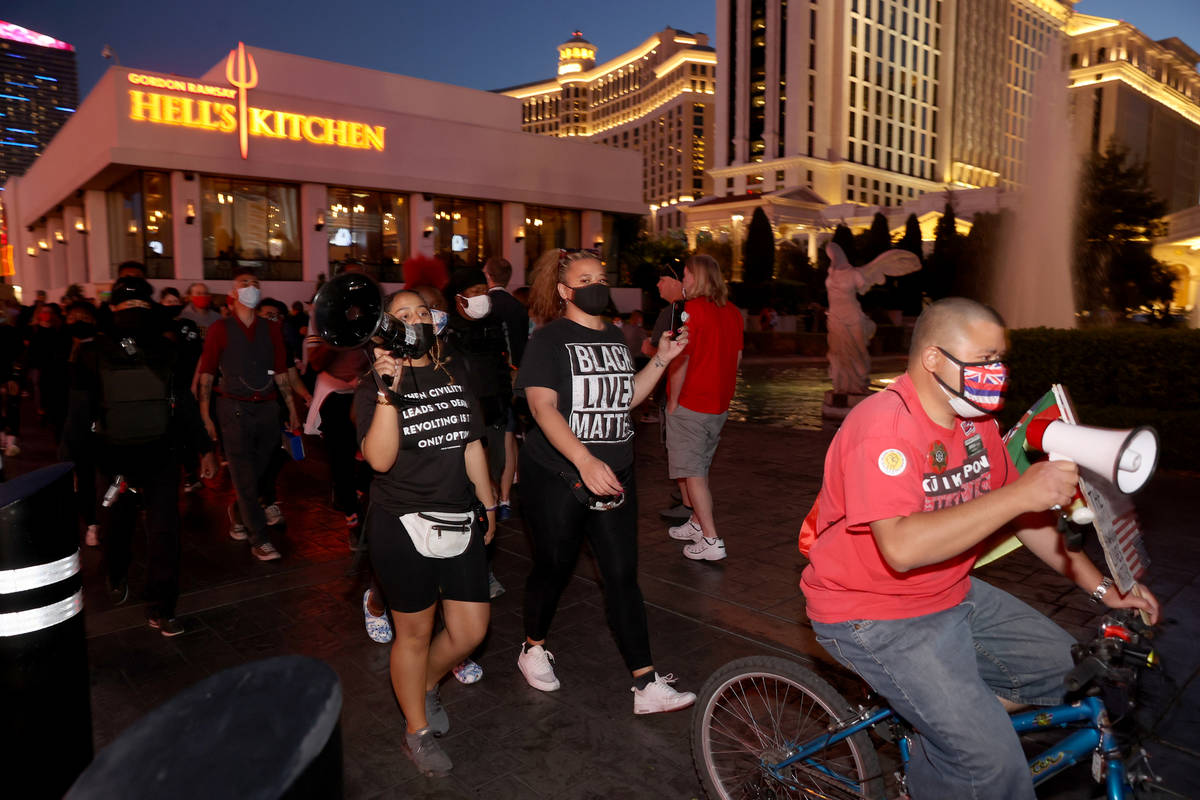Protesters, including Desiree Smith, from left, and Leinati Hackley, of More Than A Hashtag, an ...