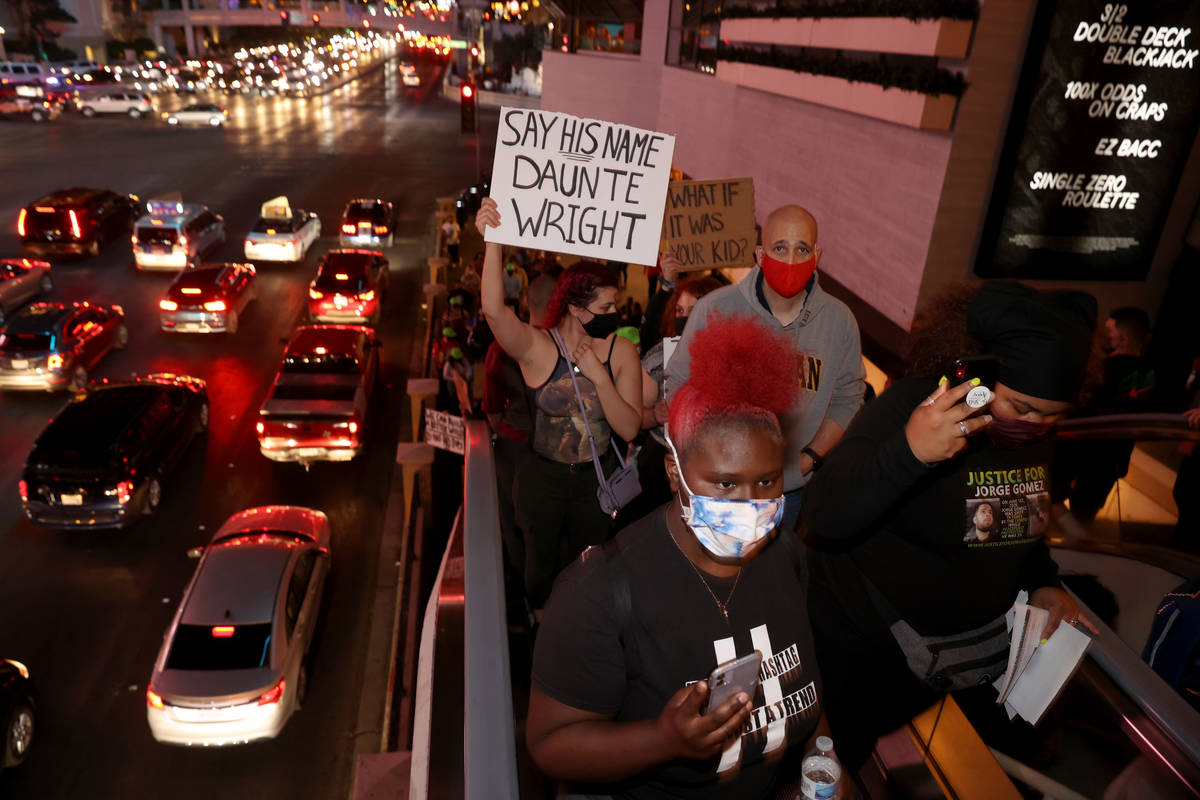 People protest on the Strip in Las Vegas Saturday, April 17, 2021, following the fatal police s ...