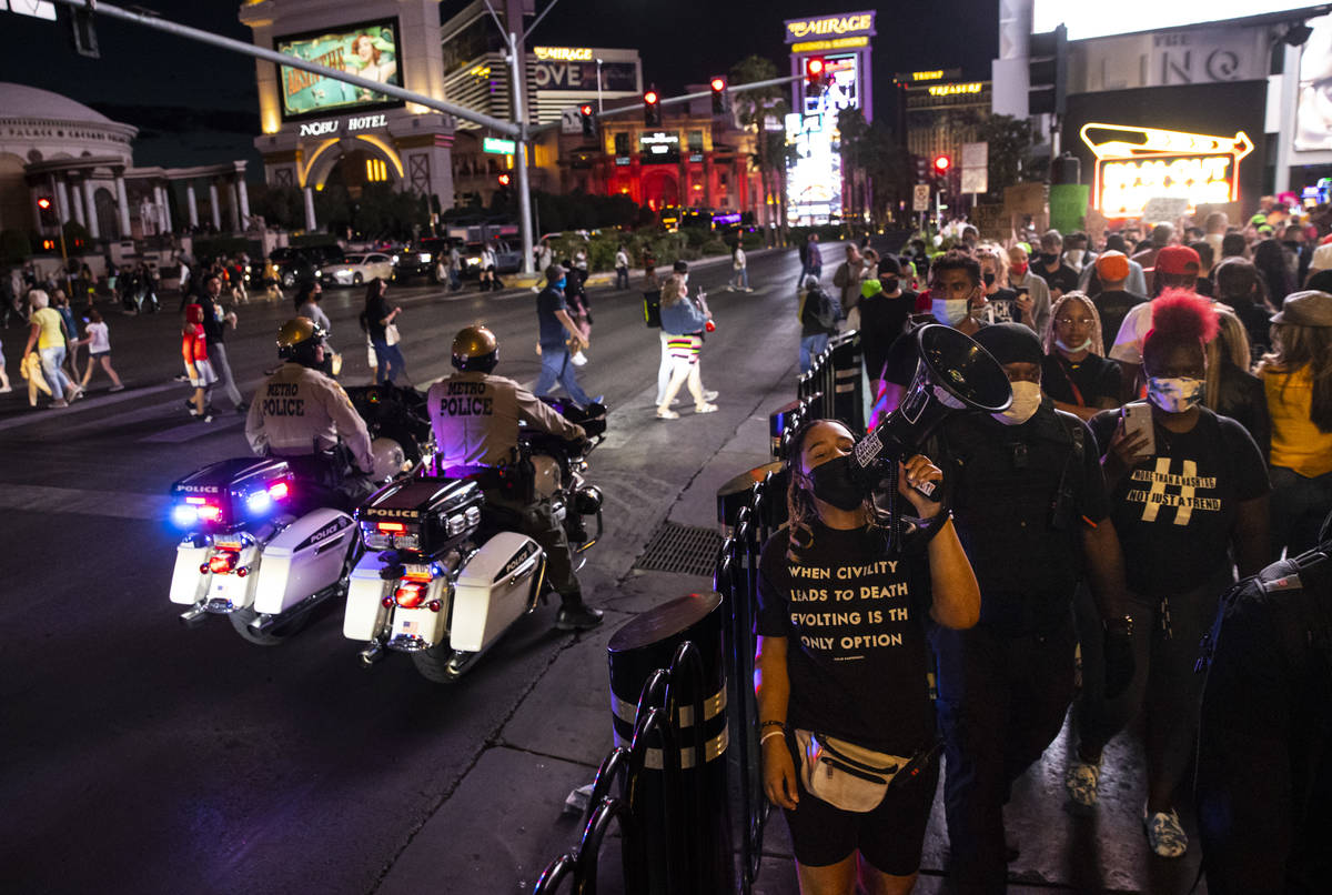 Desiree Smith, founder of More Than A Hashtag, center, leads a demonstration in solidarity with ...