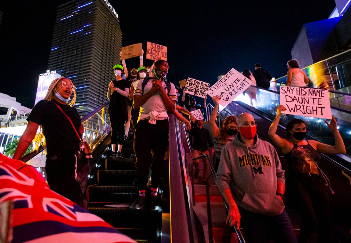 People participate in a demonstration in solidarity with the families of Daunte Wright and Adam ...