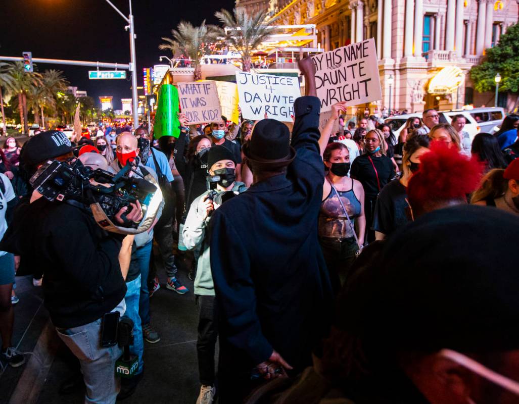 People participate in a demonstration in solidarity with the families of Daunte Wright and Adam ...