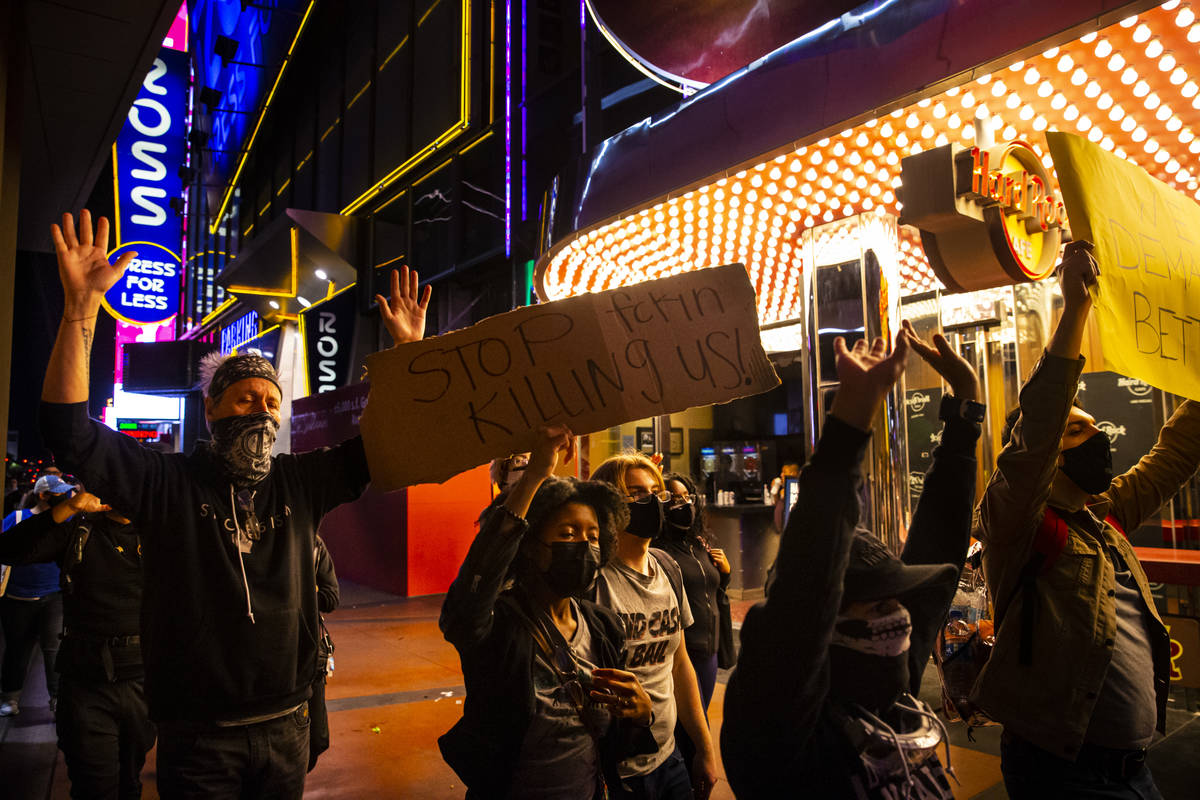 People participate in a demonstration in solidarity with the families of Daunte Wright and Adam ...