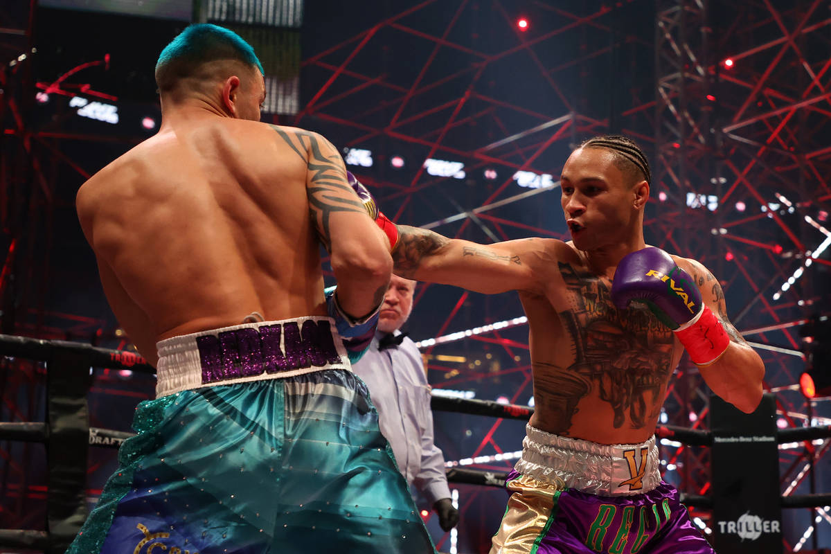 ATLANTA, GEORGIA - APRIL 17: Regis Prograis punches Ivan Redkach in their junior welterweight b ...