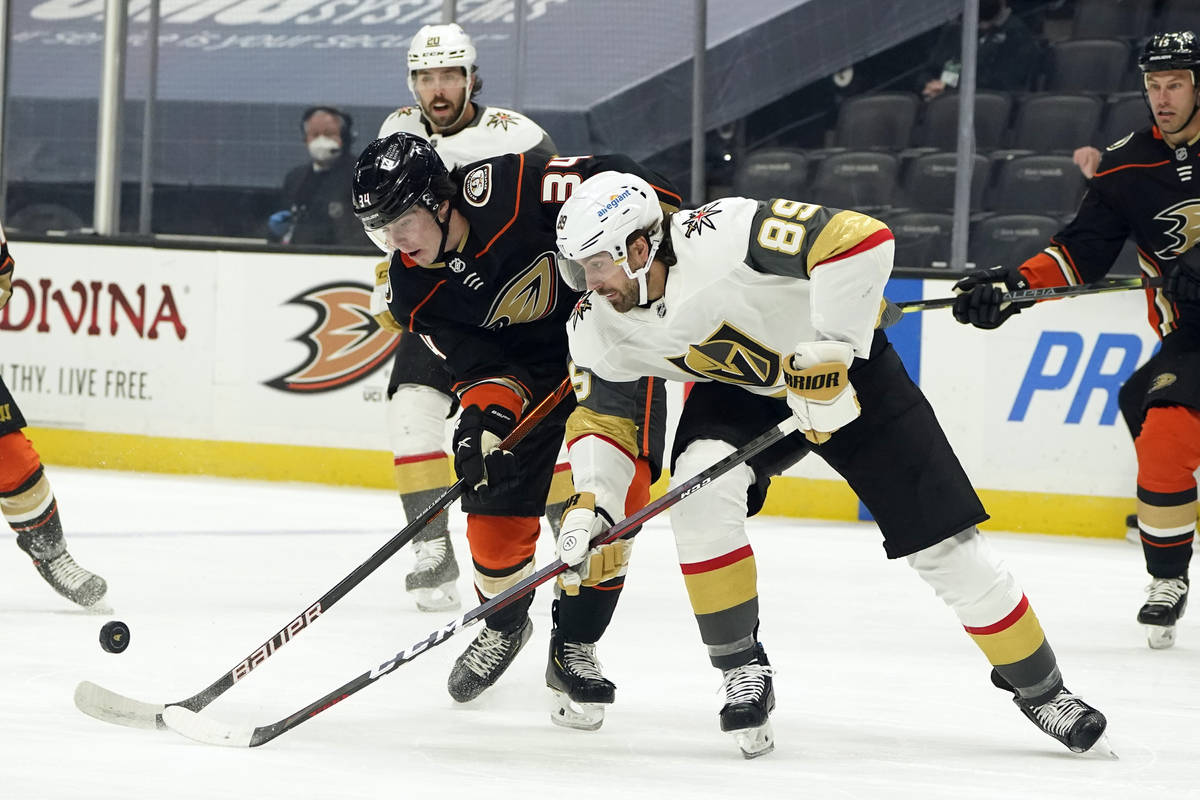 Vegas Golden Knights right wing Alex Tuch (89) works for the puck against Anaheim Ducks defense ...