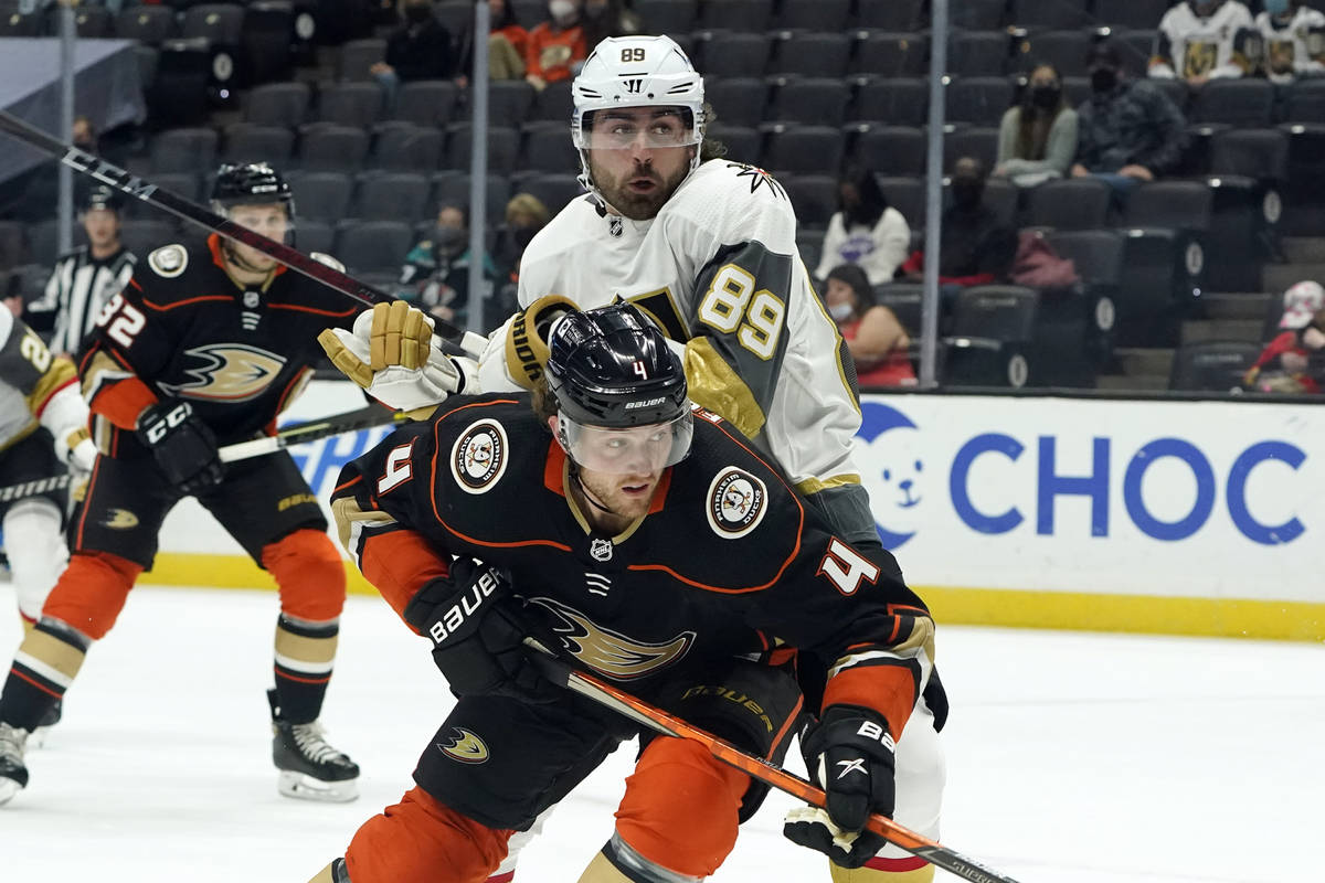 Anaheim Ducks defenseman Cam Fowler (4) defends on Vegas Golden Knights right wing Alex Tuch (8 ...