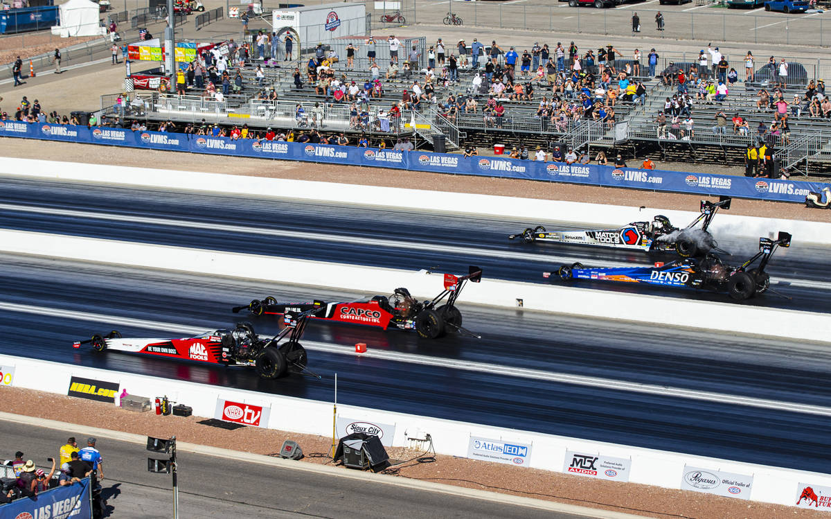 Steve Torrence, second from left, competes to win against drivers, from left, Doug Kalitta, Cla ...