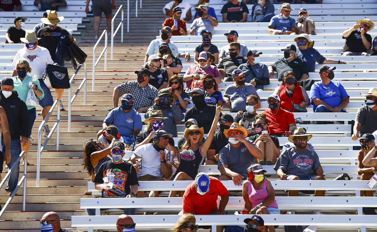 Fans cheer during the Denso Spark Plugs NHRA Four-Wide Nationals at The Strip at the Las Vegas ...