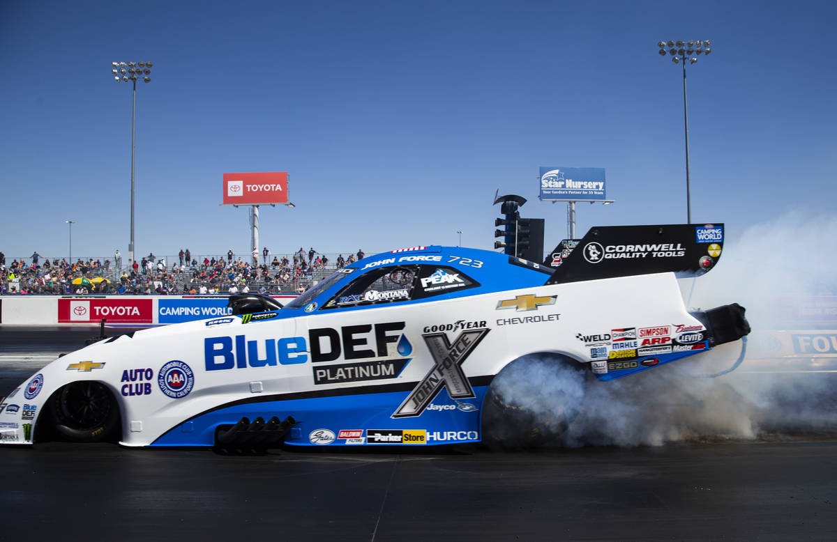John Force does a burnout in the second elimination round of Funny Car at the Denso Spark Plugs ...