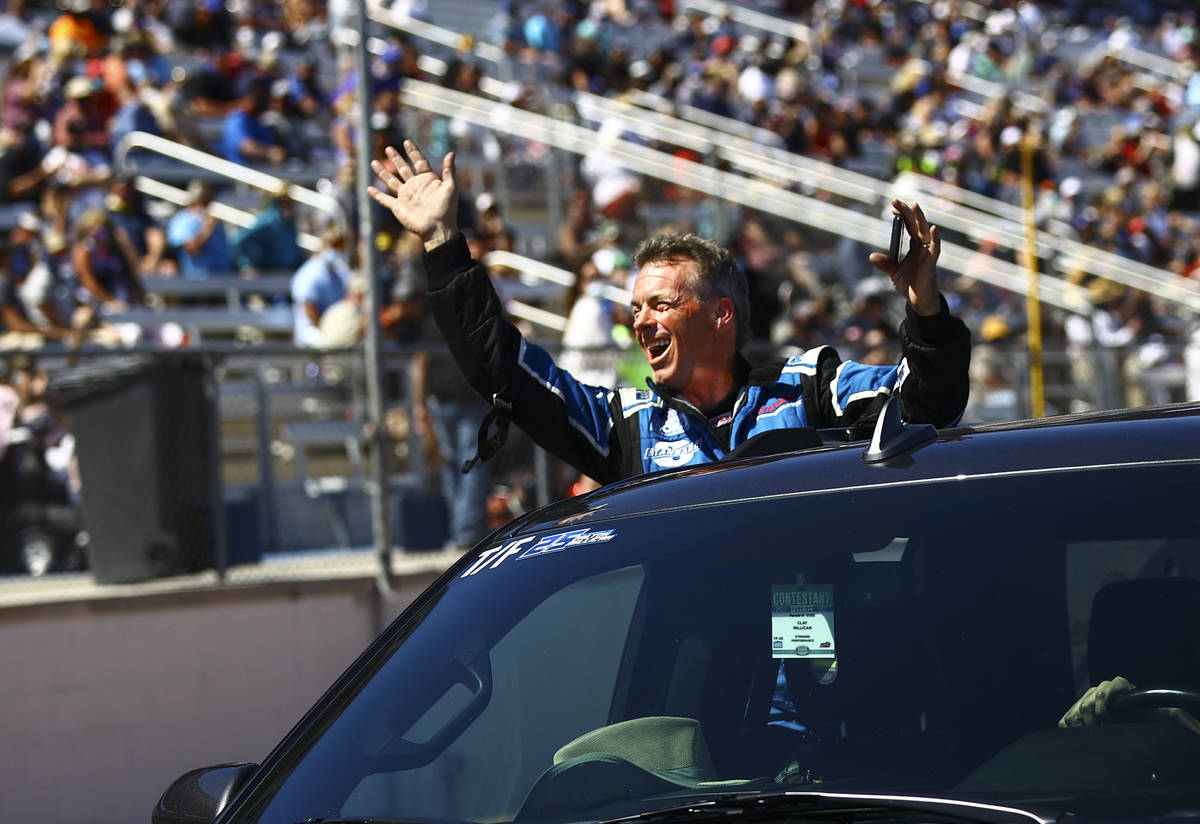 Clay Millican waves to fans after making it into the final Top Fuel round at the Denso Spark Pl ...