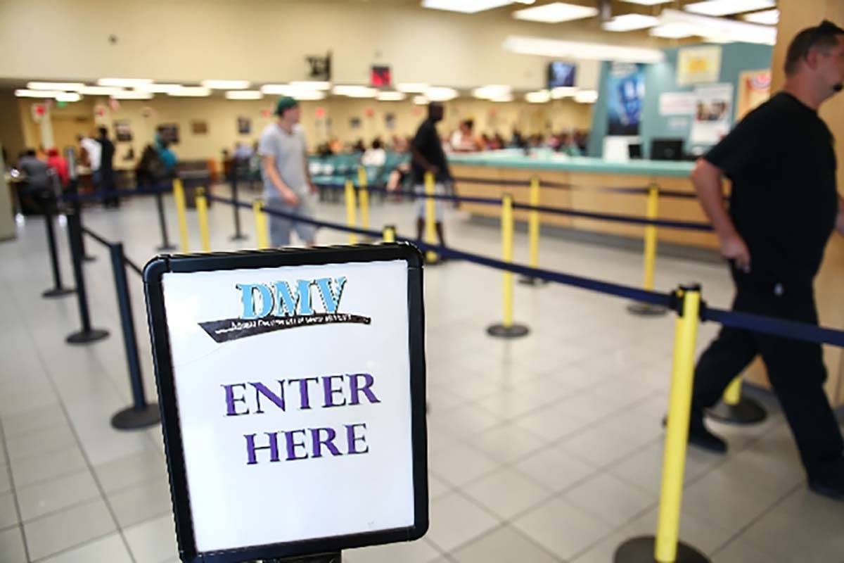 People walk through the line at the DMV office at 2701 E. Sahara Ave. in Las Vegas. (Las Vegas ...