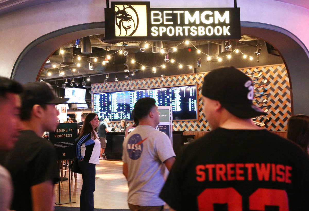 Geusts walk past the new sportsbook at Park MGM on Friday, March. 6, 2020, in Las Vegas. (Bizua ...