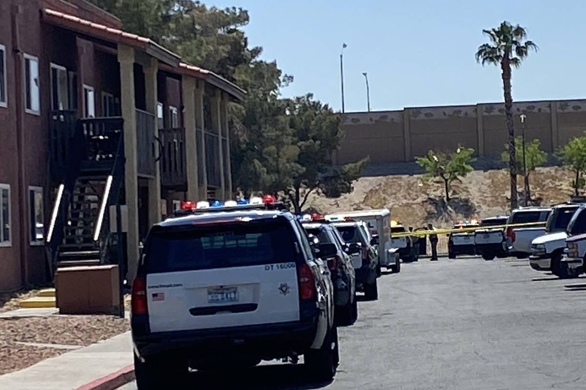 Police investigate a shooting at an east Las Vegas apartment complex on Monday, April 19, 2021. ...