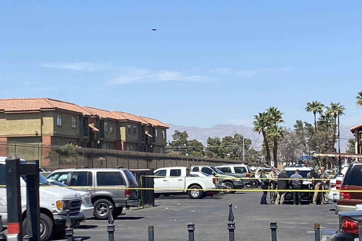 Police investigate a shooting at an east Las Vegas apartment complex on Monday, April 19, 2021. ...