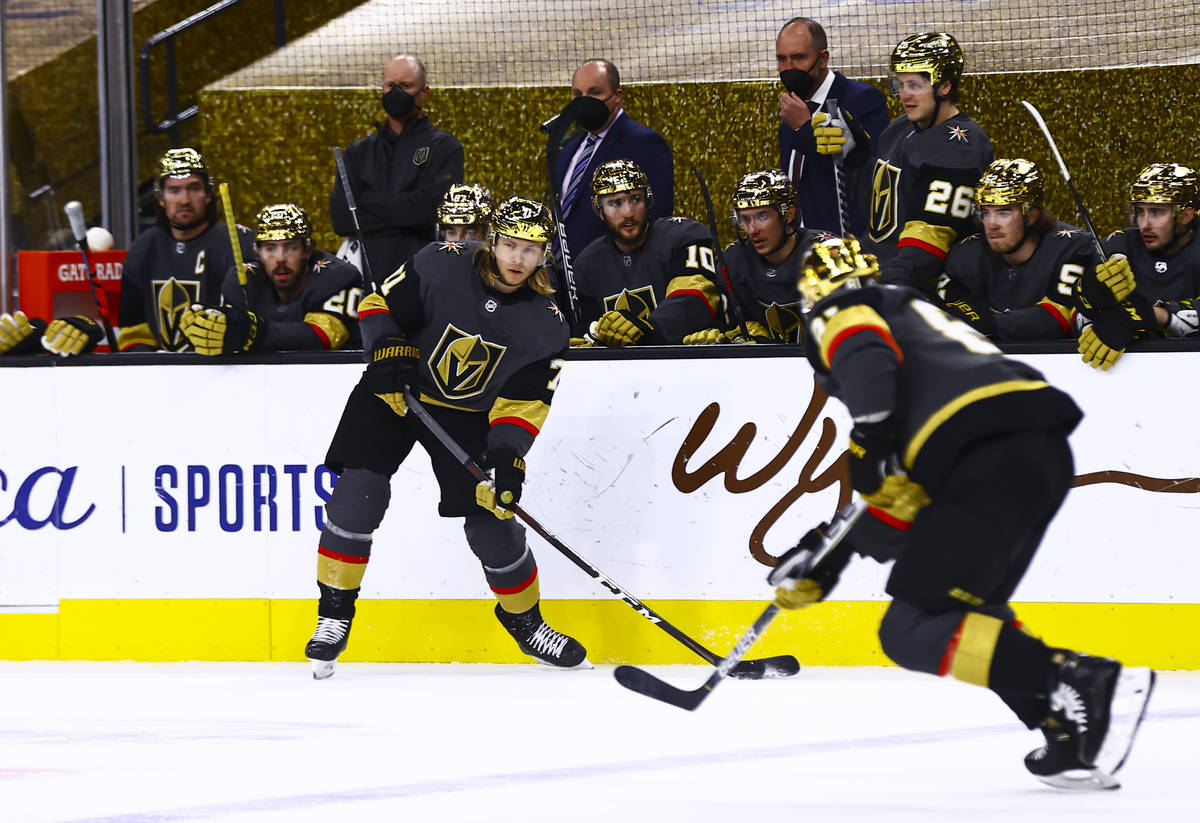 Golden Knights' William Karlsson (71) looks to pass the puck during the first period of an NHL ...