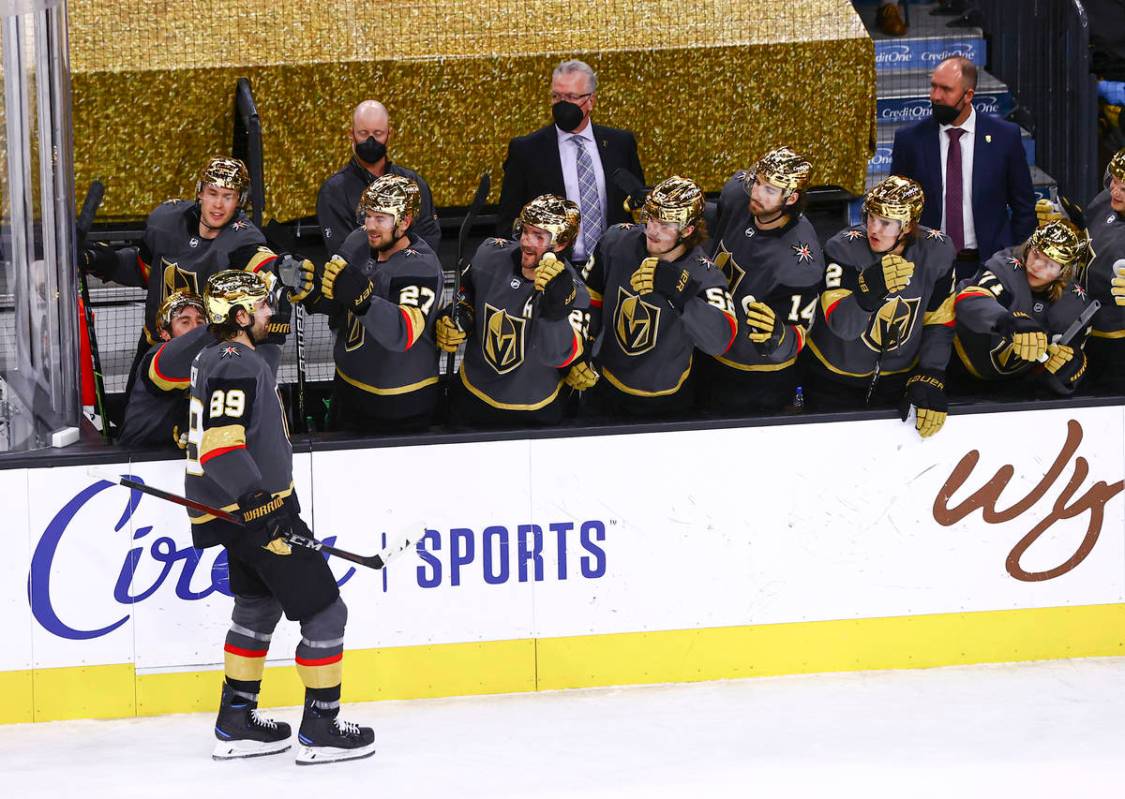 Golden Knights' Alex Tuch (89) celebrates with teammates after scoring against San Jose Sharks ...