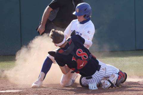 Coronado's catcher Caden Denning (18) tags Bishop Gorman's Demitri Diamant (5) for an out at ho ...