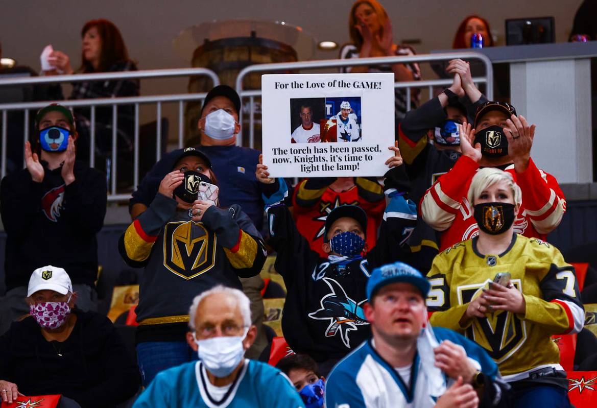 Hockey fans celebrate as San Jose Sharks' Patrick Marleau, not pictured, is honored in the 1,76 ...