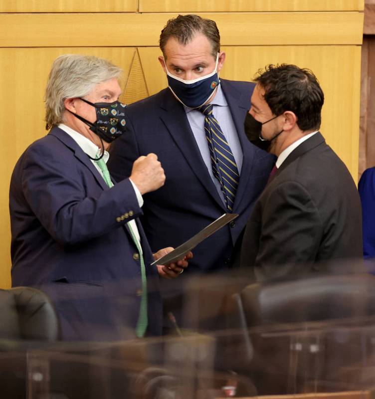 Clark County commissioners, from left, Tick Segerblom, Ross Miller and Michael Naft talk before ...