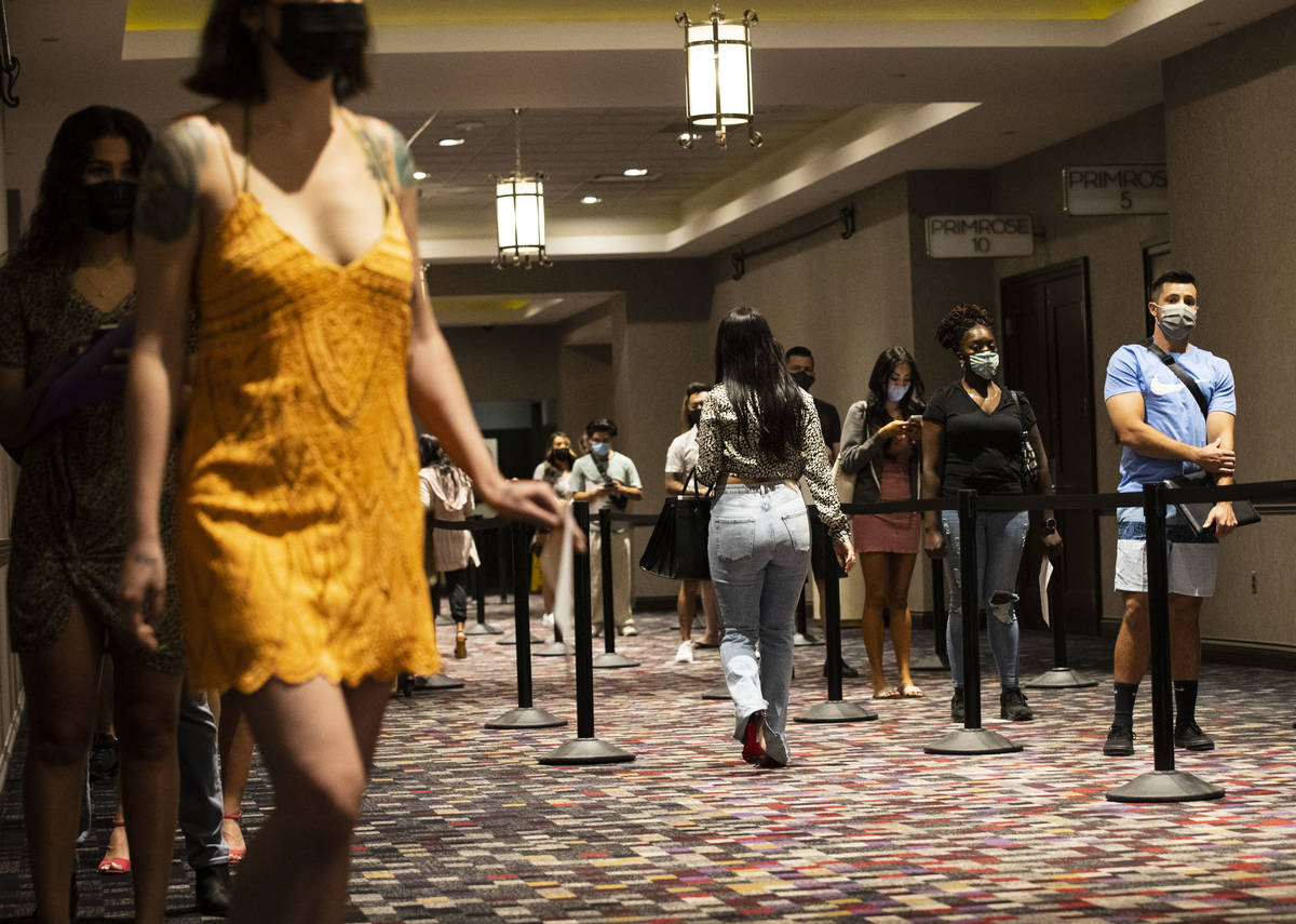 Job seekers line up to apply for jobs at Virgin Las Vegas, on Thursday, April 22, 2021, in Las ...