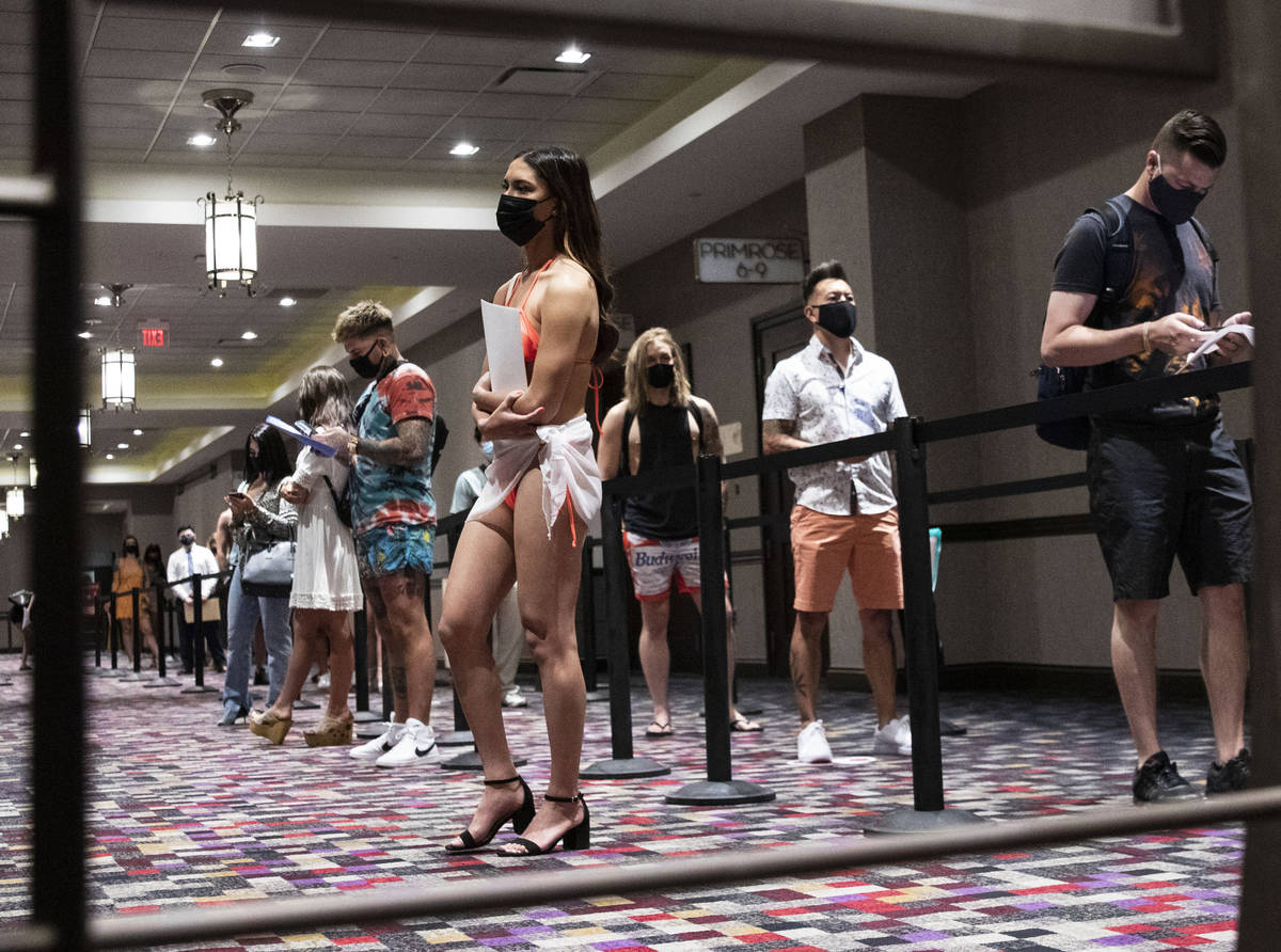 Job seekers, including Katelyn Laurente line up to apply for jobs at Virgin Hotels Las Vegas, o ...