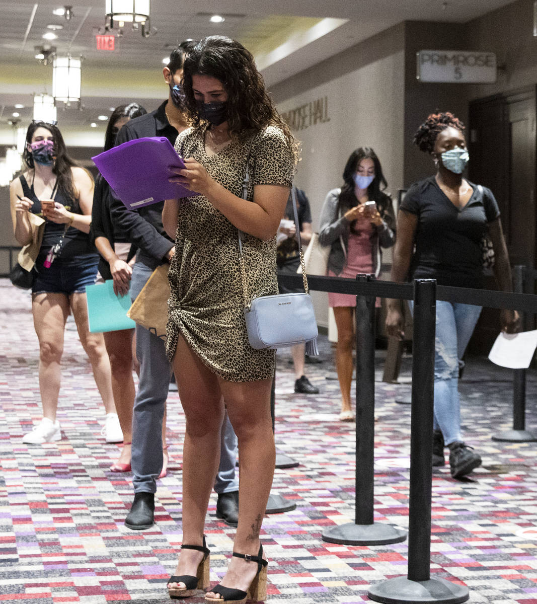 Job seekers line up to apply for jobs at Virgin Hotels Las Vegas, on Thursday, April 22, 2021, ...