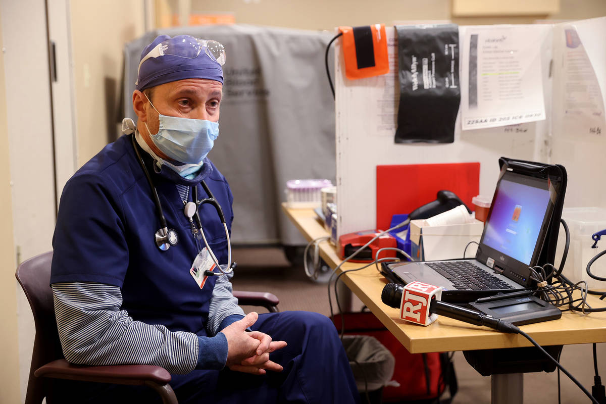 Dr. Brian Lipman talks to a reporter at St. Rose Dominican Hospital, Siena campus in Henderson ...