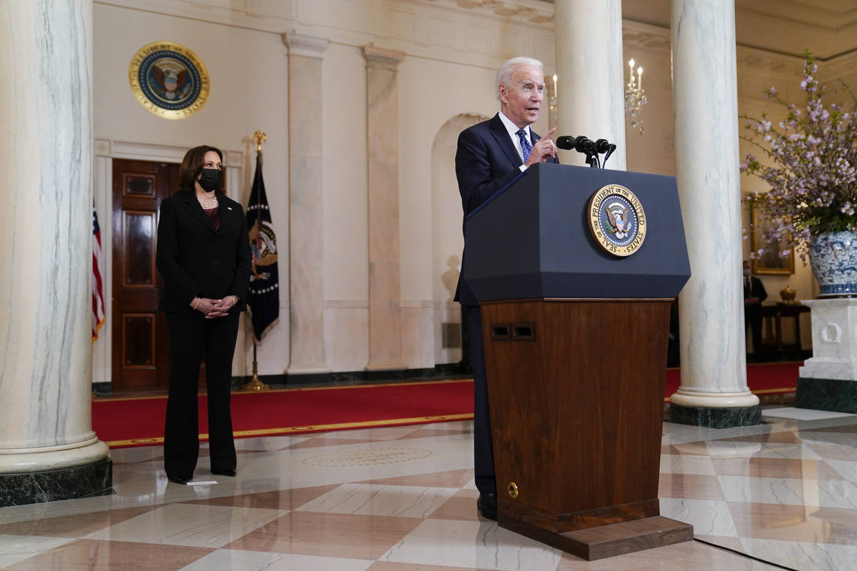 President Joe Biden, accompanied by Vice President Kamala Harris, speaks Tuesday, April 20, 202 ...