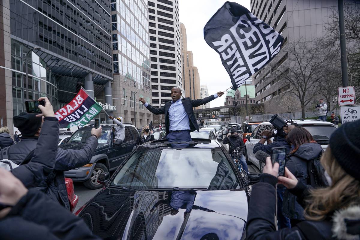 People rally outside the courthouse in Minneapolis on Tuesday, April 20, 2021, after the guilty ...