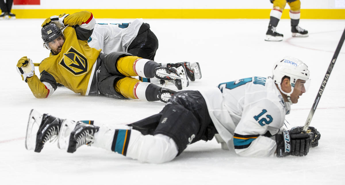 Golden Knights center Chandler Stephenson (20) looks on from the ice as he and San Jose Sharks ...