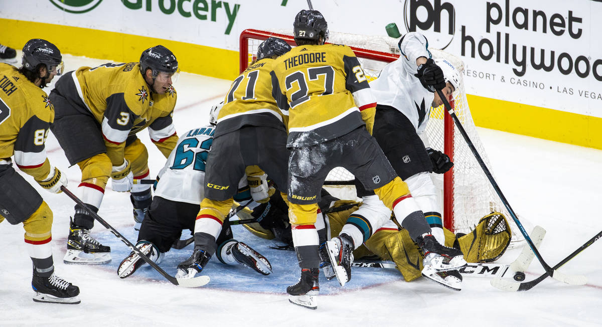 Golden Knights goaltender Marc-Andre Fleury (29) somehow gets his glove on a shot by San Jose S ...