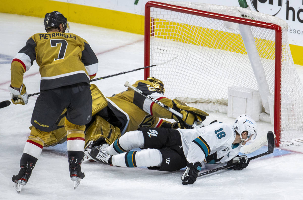 Golden Knights goaltender Marc-Andre Fleury (29) makes another diving save on San Jose Sharks c ...