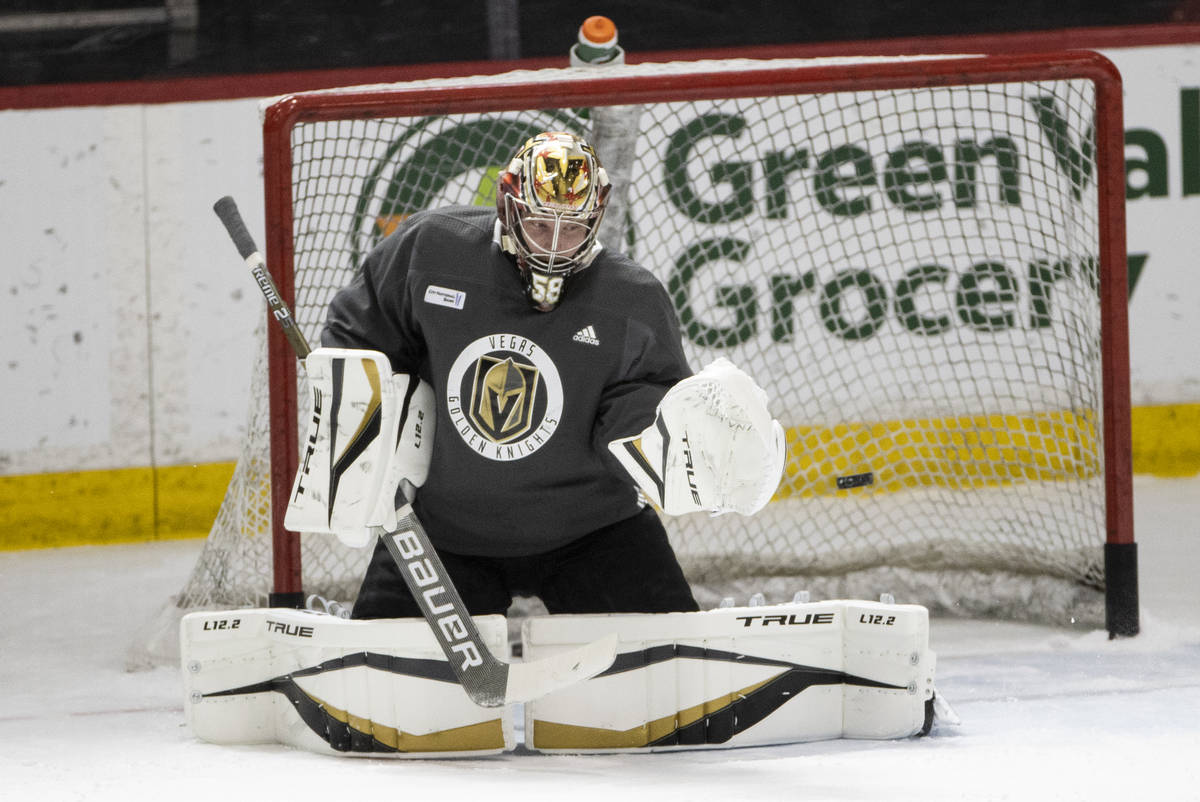 Vegas Golden Knights goaltender Robin Lehner (90) defends a shot during a team practice at City ...