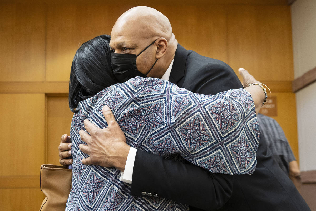Former NBA player Jackie Robinson hugs his sister Judy Robinson after the Clark County Commissi ...