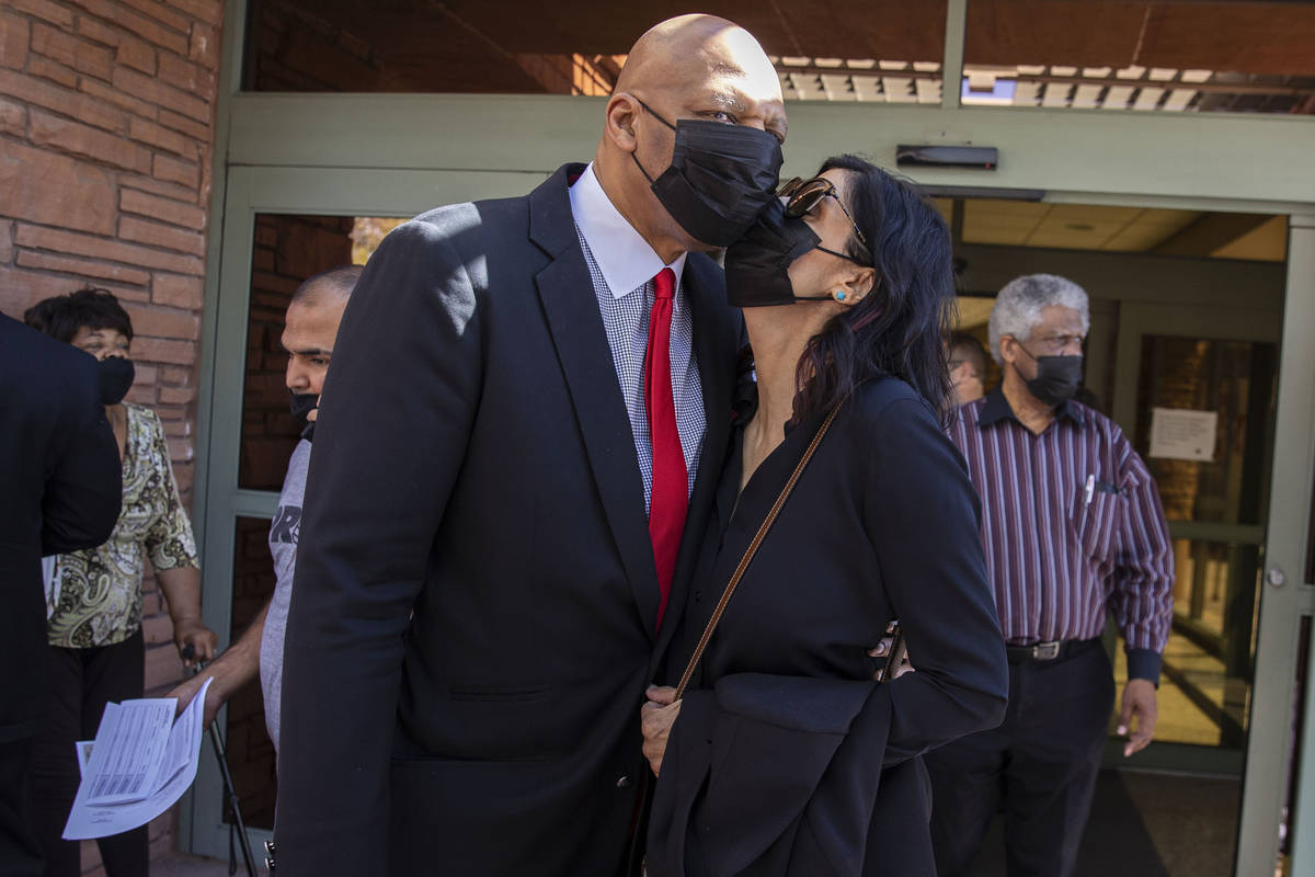 Former NBA player Jackie Robinson embraced by his wife Maria after the Clark County Commission ...