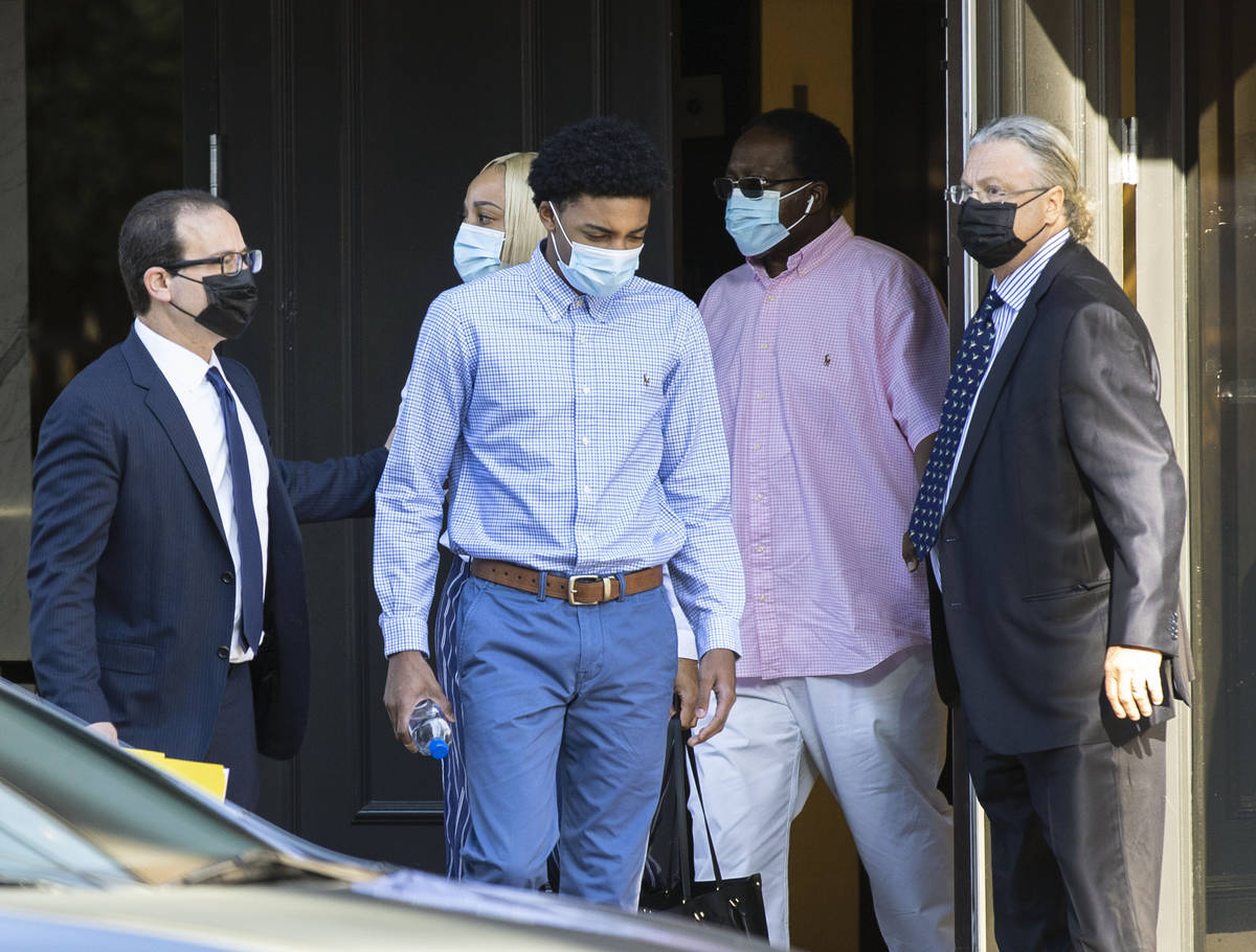 Former Bishop Gorman High School basketball standout Zaon Collins, center, leaves his attorneys ...