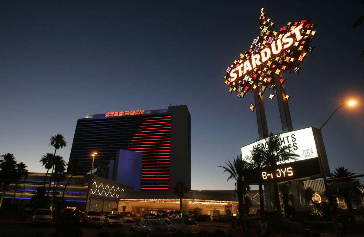 The Stardust hotel-casino glows in its signature blue and red neon as the sun sets Tuesday, Jun ...