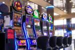 Slot machines are seen in the baggage area in Terminal 1 at McCarran International Airport in M ...
