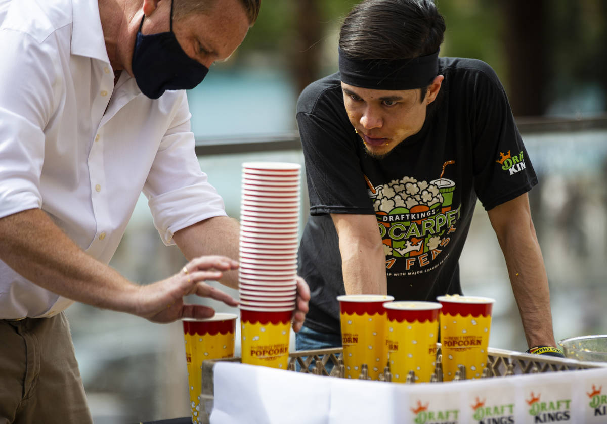 Matt Stonie looks on as his cups are tallied in the World Popcorn Eating Championship during th ...