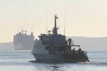 An Indonesian navy patrol ship sails to join the search for submarine KRI Nanggala that went mi ...