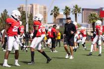UNLV men's football head coach Marcus Arroyo watches his players during teamÕs practice on ...