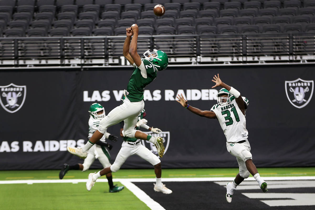 Rancho's Raymond Conner (2) tips the ball as Saied Koroma (31) looks on during a team practice ...