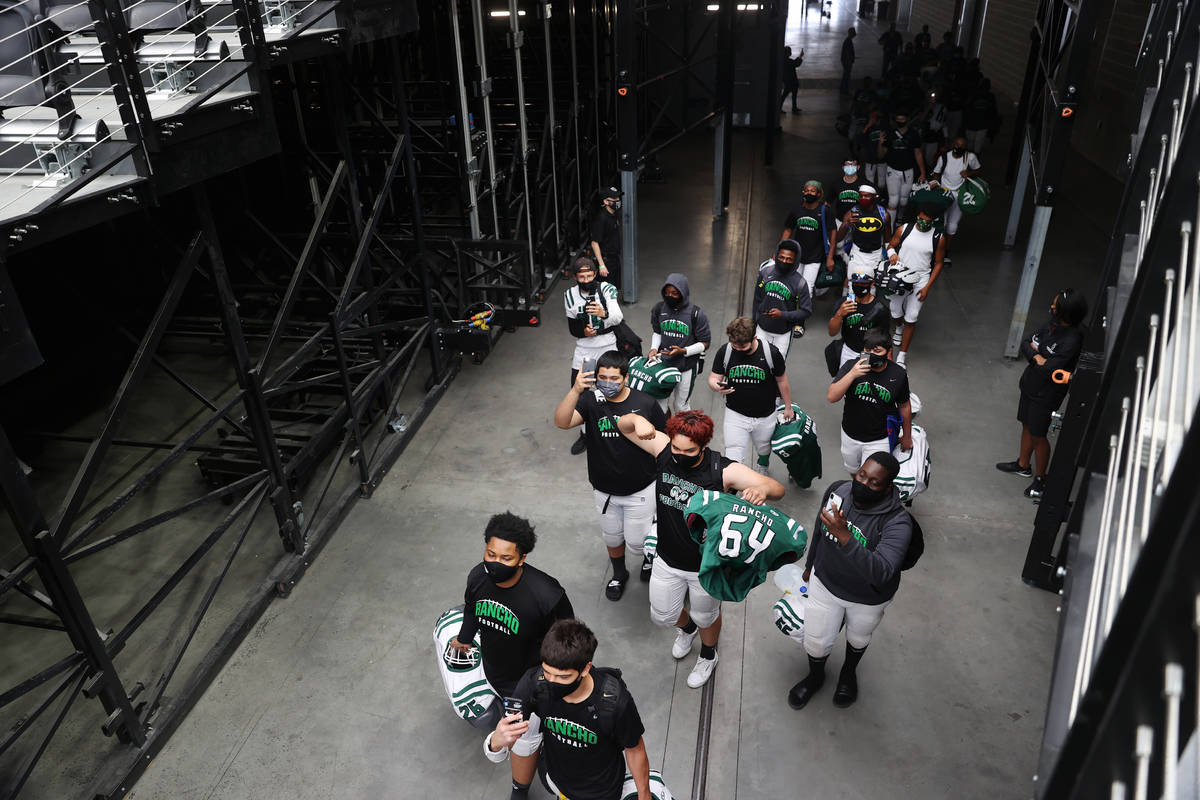 Rancho players enter Allegiant Stadium in Las Vegas for a team football practice, Saturday, Apr ...