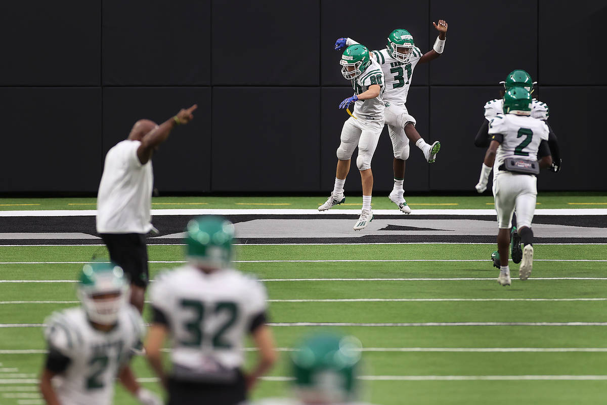 Rancho's Saied Koroma (31) celebrates a touchdown with teammate Victor Arellano (80) during a t ...