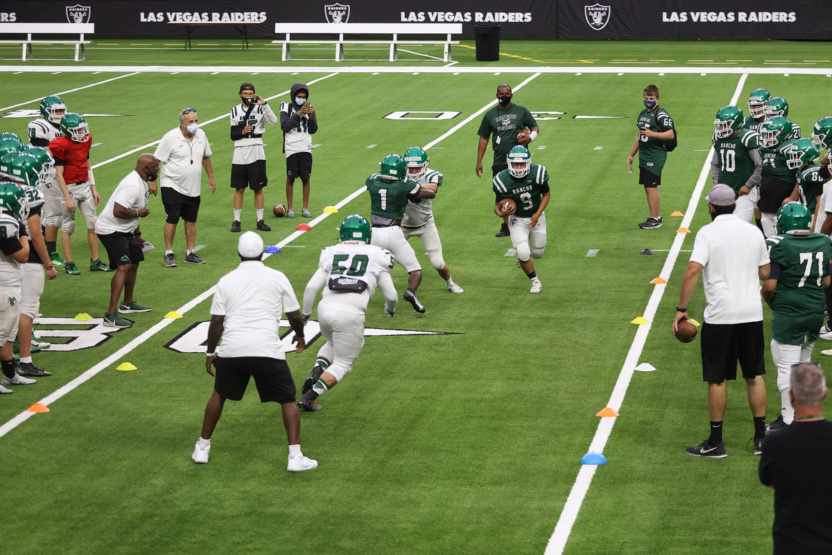 Rancho's Chris Solis (9) runs the ball during a team practice at Allegiant Stadium in Las Vegas ...
