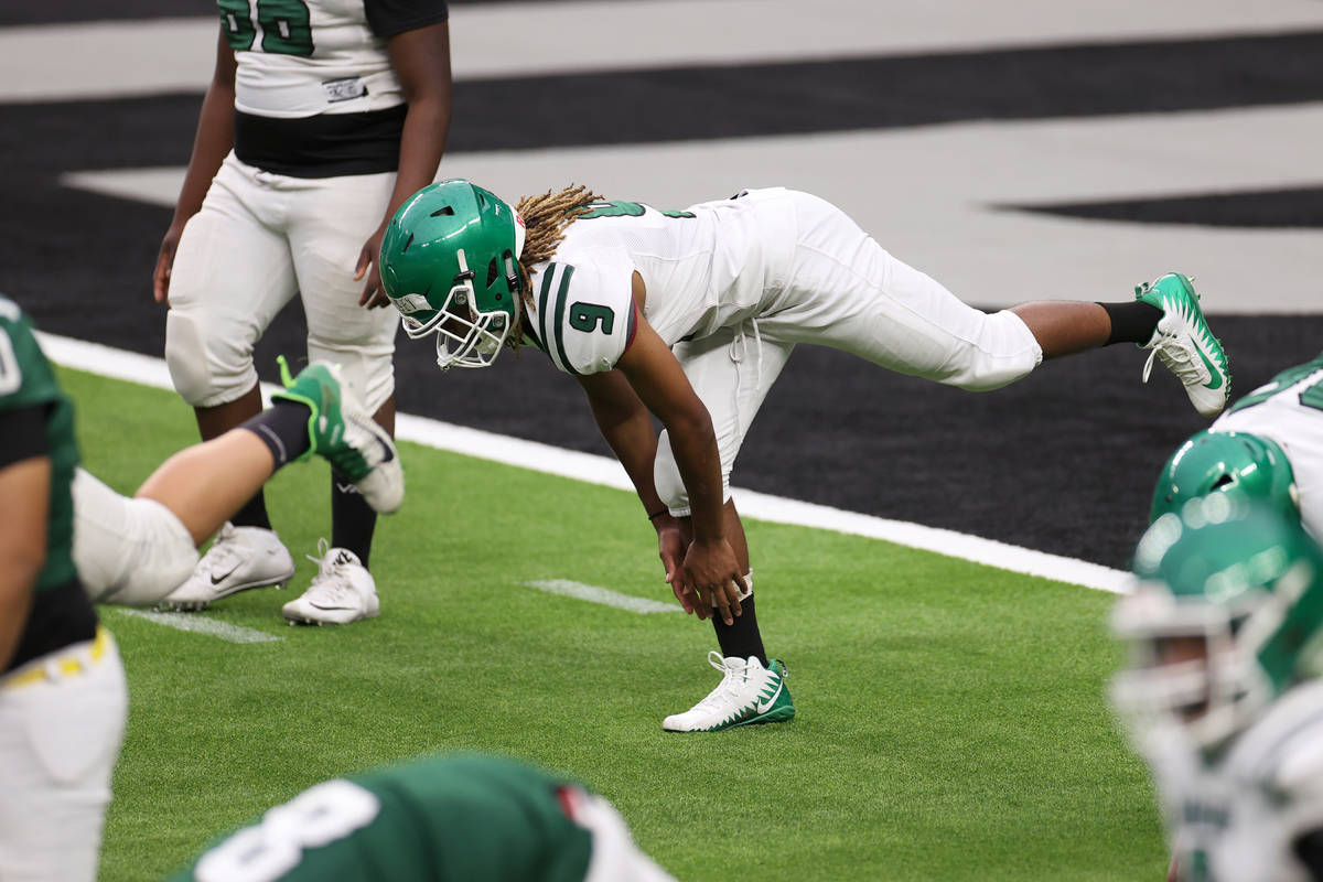 Rancho's Lebron Dorsey (9) stretches during a team football practice at Allegiant Stadium in La ...