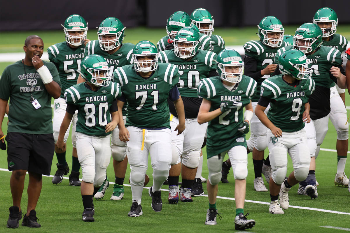 Rancho takes the field during a team football practice at Allegiant Stadium in Las Vegas, Satur ...